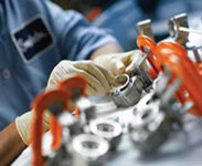 machined plastic components being assembled